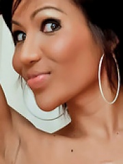 Stunning tanned ladyboy jerks off her dick
